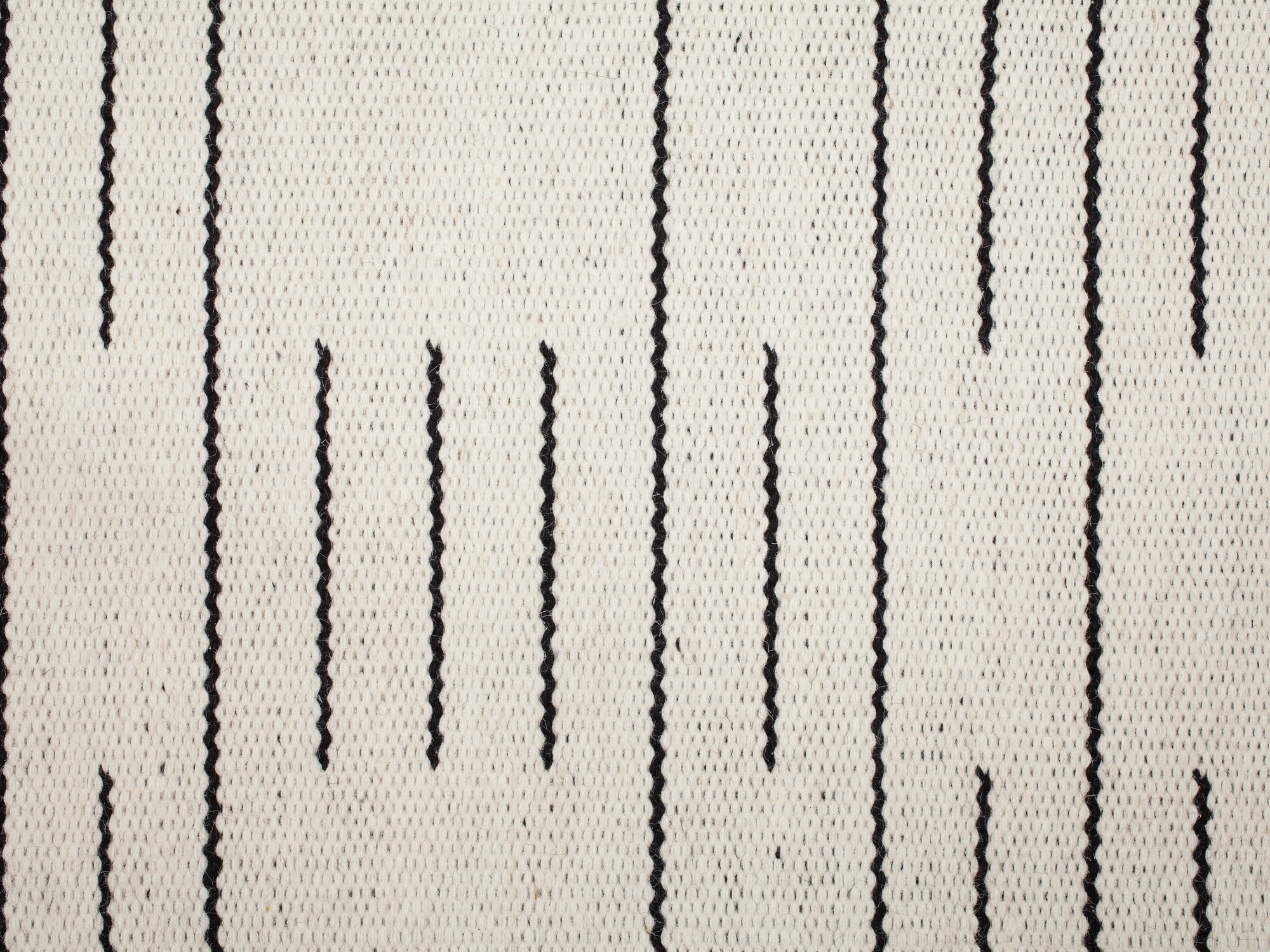 Detail view of white and black modern rug